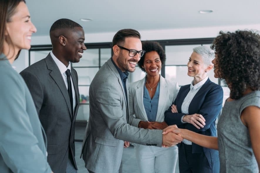 Diverse team celebrating a successful partnership